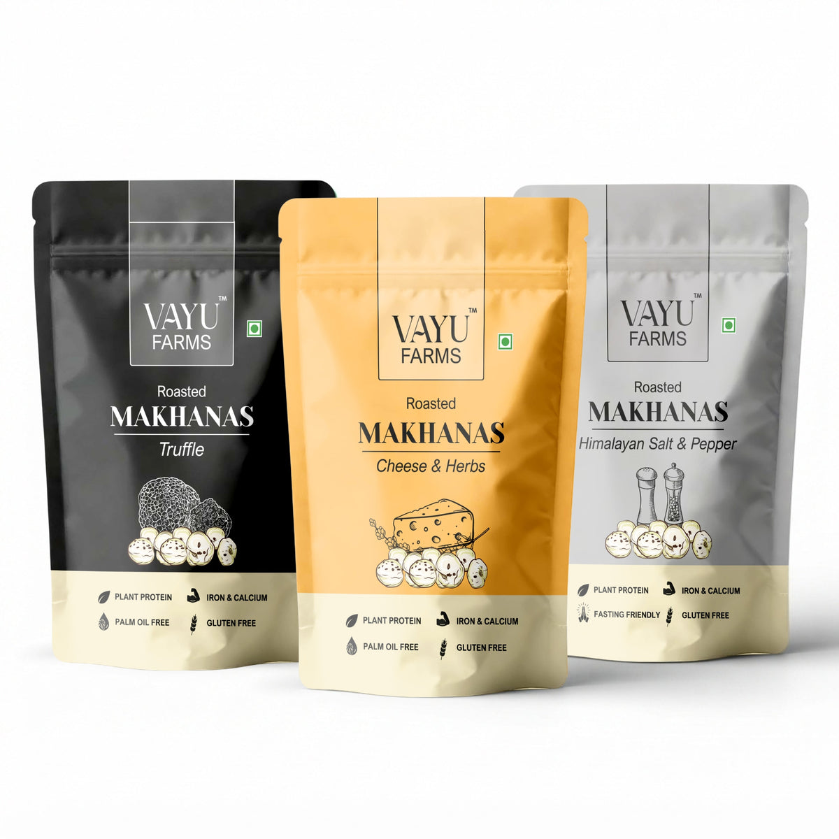 Three stand-up pouches of Vayu Farms Roasted Makhanas — Truffle, Cheese & Herbs and Himalayan Salt & Pepper — on a white background.