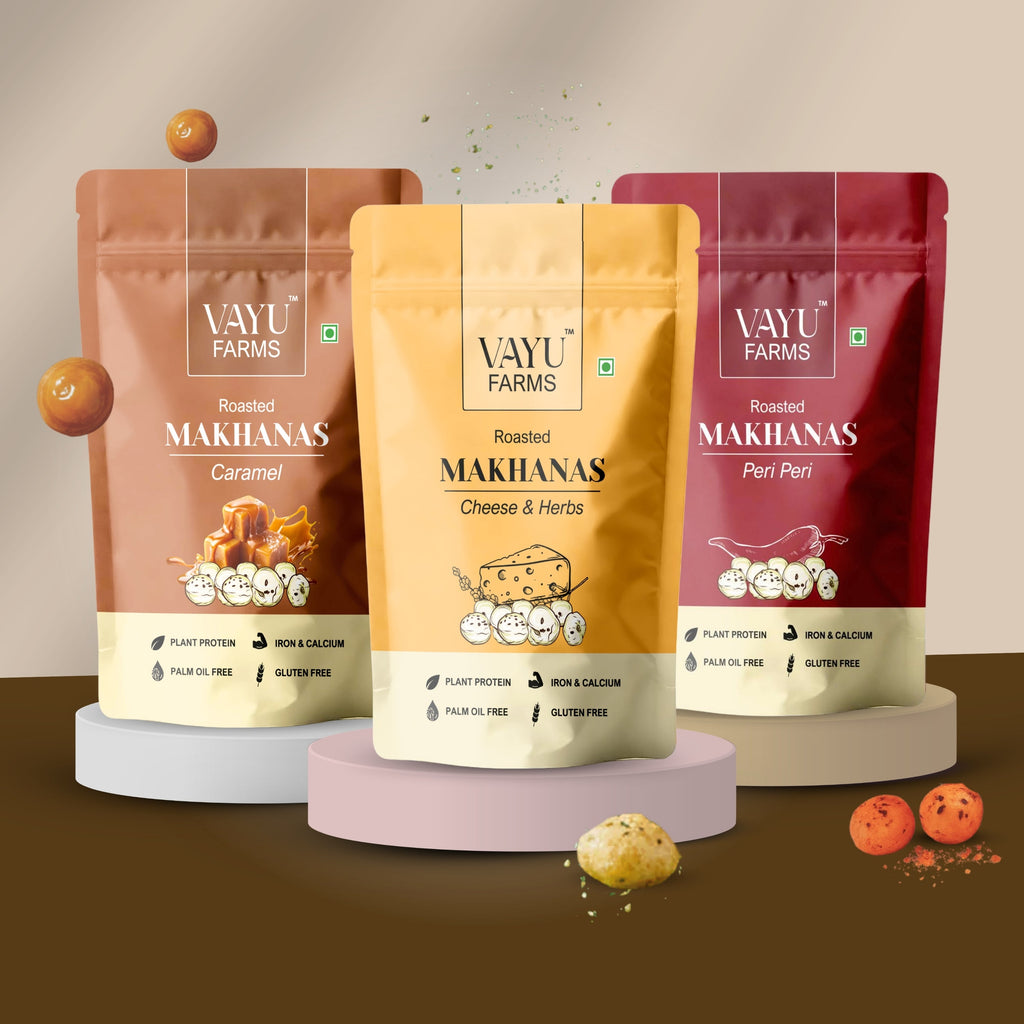Three stand-up pouches of Vayu Farms Roasted Makhana in Caramel, Cheese & Herbs, and Peri Peri flavours