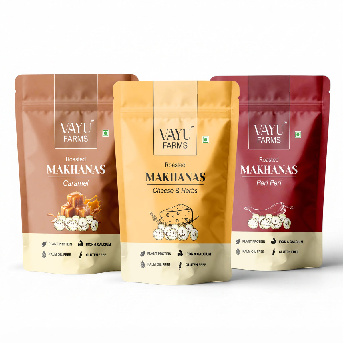 Three stand-up pouches of Vayu Farms Roasted Makhana in Caramel, Cheese & Herbs, and Peri Peri on a white background