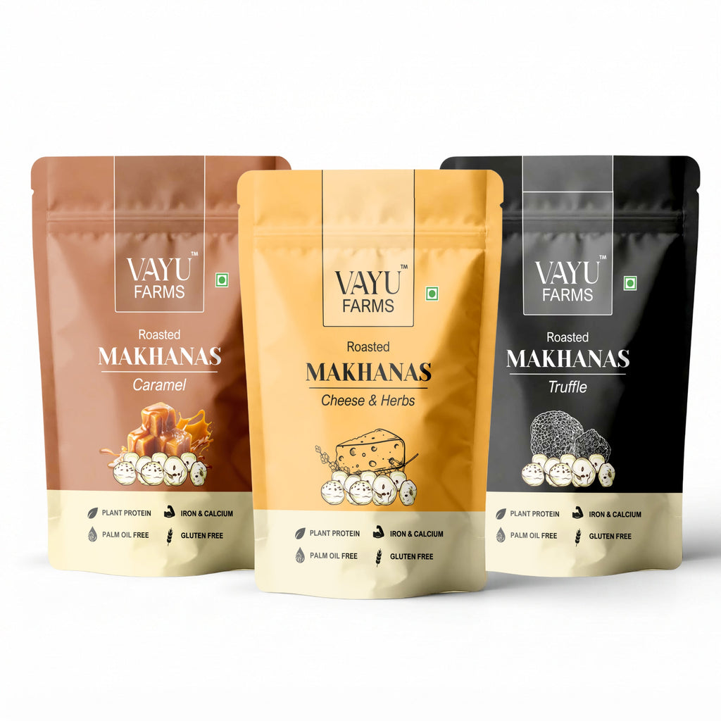 Three stand-up pouches of Vayu Farms Roasted Makhana in Caramel, Cheese & Herbs, and Truffle on a white background