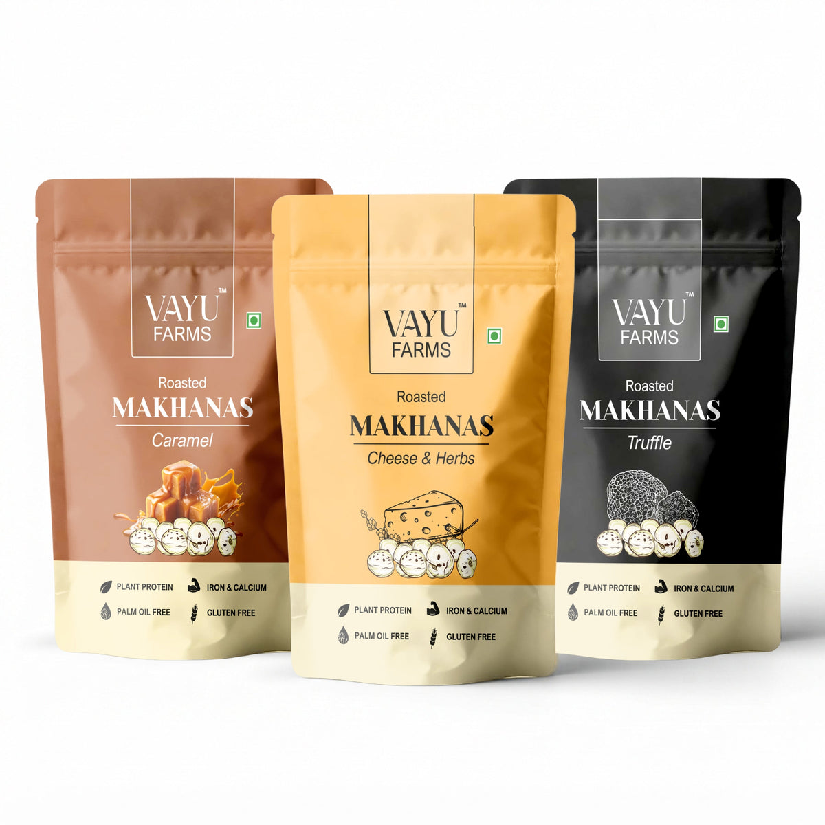 Three stand-up pouches of Vayu Farms Roasted Makhana in Caramel, Cheese & Herbs, and Truffle on a white background