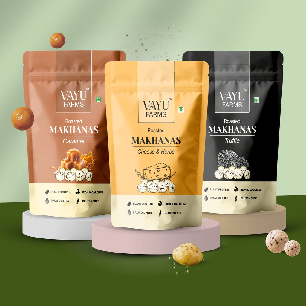 Three stand-up pouches of Vayu Farms Roasted Makhana in Caramel, Cheese & Herbs, and Truffle flavours